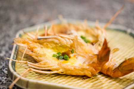 Grilled river prawns or shrimps with cheese, delicious and fragrant, hais are popular to eat with spicy seafood sauce with chili ingredients , garlic, lemon spicy Thai style.の写真素材
