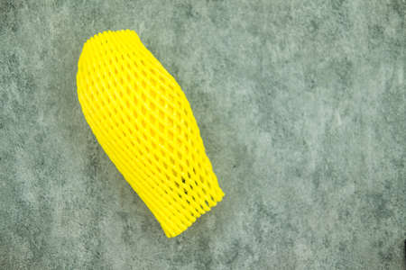 Ripe mango, mangoes wrapped by yellow cushioning foam. Thai exotic fresh fruit.の写真素材