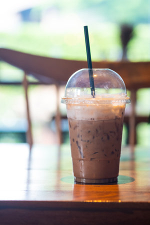 Iced coffee in a plastic cup. Cold summer coffeeの写真素材