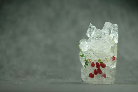 Fruit frozen inside transparent ice cube, Close upの写真素材