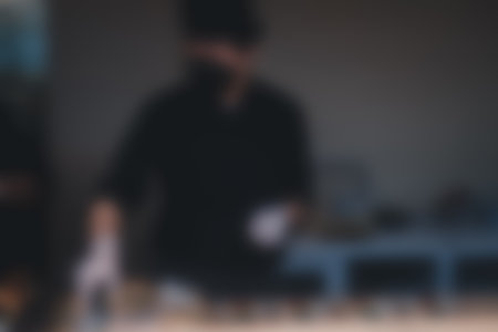 Blurred photo of Asian man Chef making sushi sashimi at a restaurant