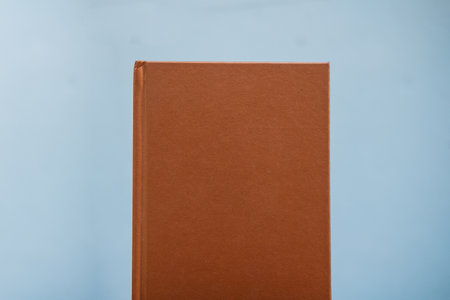 Copper color notebook on a white backgroundの写真素材
