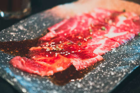 Premium Japanese sliced wagyu beef on plate for yakiniku. Luxury beef menuの写真素材