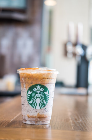 Bangkok, Samut Prakan - May 29, 2022 : A glass of Almondmilk White Chocolate Affogato Frappuccino from Starbucks coffee. Starbucks is the world's largest coffeehouse and is highly popularのeditorial素材