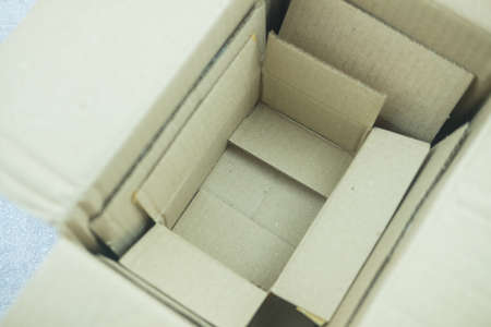 Open small cardboard boxes stacked inside. Small box in big box
