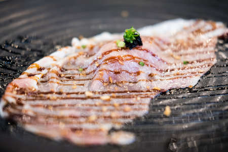 Medium rare sliced authentic A5 grade Japanese wagyu beef sushi topping with sauce.の写真素材