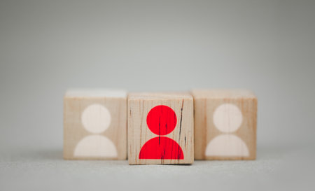 Red wooden cube with person icon stand out from the crowd. In concept of leadership. HR conceptの写真素材