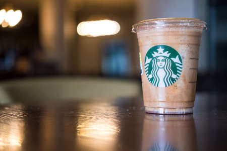 Bangkok, Samut Prakan - June 18, 2022 : A glass of Almondmilk White Chocolate Affogato Frappuccino from Starbucks coffee. Starbucks is the world's largest coffeehouse and is highly popularのeditorial素材