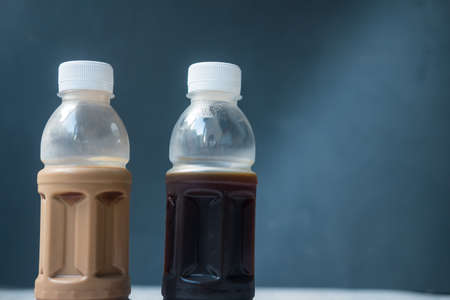 Two bottle of black coffee and mocha coffee, ready to drinking in home. The concept of food delivery to homeの写真素材