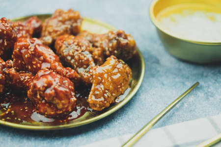 A view of two different kinds of Korean fried chicken. Close upの写真素材