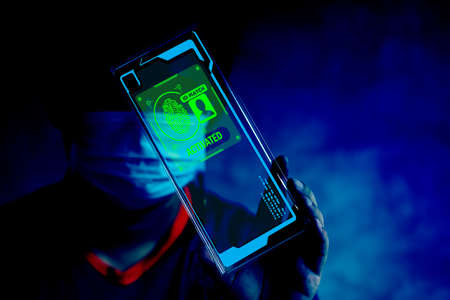 Man showing digital id and fingerprint scanner for identity verification, match activated. Biometric verification. The concept of verify identity of IT security and protectionの写真素材