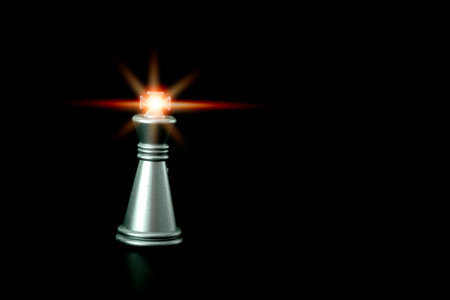 Stand of silver king chess to represent the business strategy. Winner of business competition and...