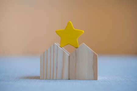 The yellow star placed on a two house. The concept of the best housing, making right decision on home investment concept.の写真素材