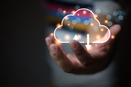 Hand holding virtual cloud computing technology. Cloud technology management big data includes...