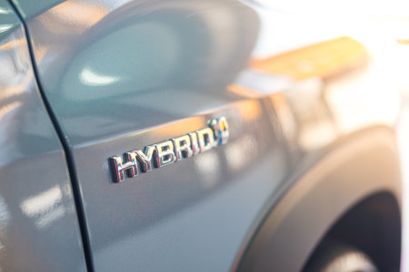 Samut Prakan, Thailand - July 16, 2022 : Close up of Hybrid sign-on All-new Toyota Corolla Cross car with 1.8 liter hybrid engineのeditorial素材