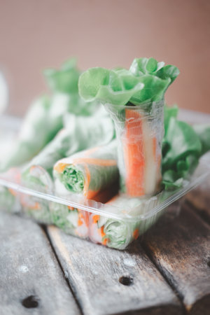 Salad rolls, made from vegetables and flour eating with salad dressing served in boxの写真素材