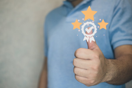 Man show thumb up in meaning "Great" with three Star Rating. Best Excellent services for Satisfaction or for guarantee product and ISO service concept. Concept of standardizing products and servicesの写真素材