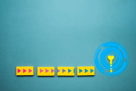Arrow icon on yellow wood block point towards heart. Way of loveの写真素材