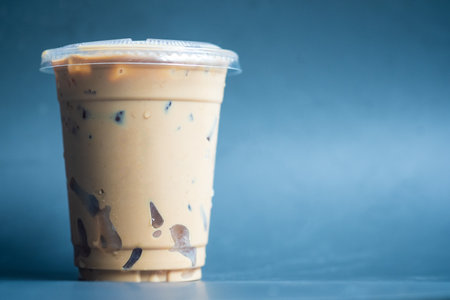 A glass of iced coffee in disposable plastic cup. Close upの写真素材