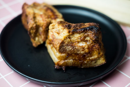 Side view of crispy golden pork belly. Deep fried crispy pork bellyの写真素材