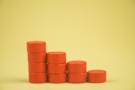 Bar graph made of red building blocks. Business concept. Red wood cube blocks like bar graph...