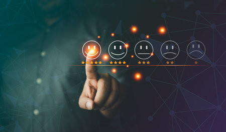 The customer pressing smiley face emoticon on the virtual touch screen and rated the service quality excellent. Customer service evaluation concept. The best of service qualityの写真素材