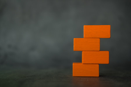 Empty of toy four orange blocks piled together with copyspace.の写真素材