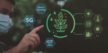 Farmer man uses virtual reality artificial intelligence (AI) to analyze plants in agriculture. Technology smart farming and agricultural innovation concepts. Smart farming with IoT.の写真素材