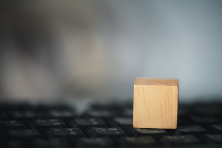 Empty wooden block on black computer keyboard. Close upの写真素材