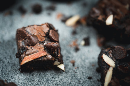 Almond butter brownies dates topping with almonds and chocolate chips. Selective focusの写真素材
