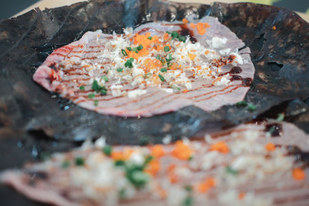 Raw wagyu beef on Hoba leaf. Japanese food style.の写真素材