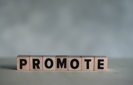 Wood block of PROMOTE, use the image for concept of business achievement, great work results or job...