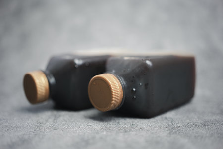 Two plastic bottles of black coffee. Close upの写真素材