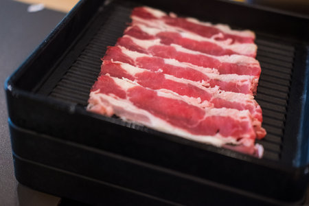 Fresh beef slices with ingredients background for Japanese shabu-shabu or Sukiyaki.の写真素材