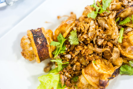 Deep fried squid with garlic. Thai style seafood appetizerの写真素材