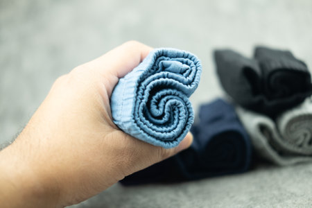 Man hand keep blue men's underwear. Close upの写真素材