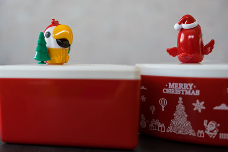 Bangkok, Thailand - December 17, 2022 : Plastic red box for cake with logo and mascot of Cafe Amazon. Souvenir gets free for a customer two drink order at cafe amazon in Thailand.のeditorial素材