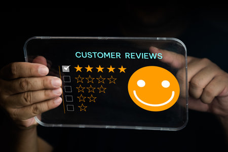 Customer touching the virtual screen on five star and the happy smiley face icon sends feedback to service experience online applications. Customer service and satisfaction rating concept.の写真素材