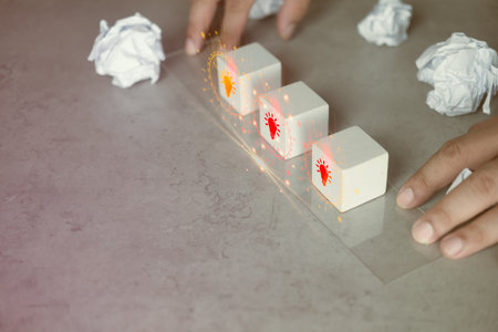 New idea concept with icon light bulb on wood block with crumpled paper around. Creative thinking...