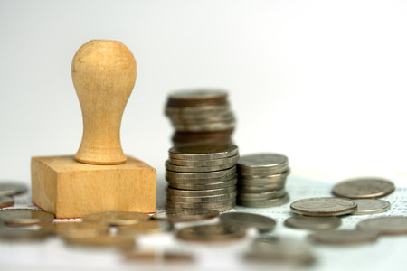 The concept of loan approval, wood stamp with a stack of money, Financial loan money contract agreement company or personの写真素材