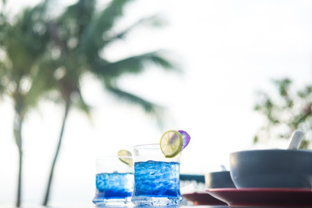 Thai herbal juice. Fix body heat. Decorate the beautiful glass with lemon and butterfly pea flowers...