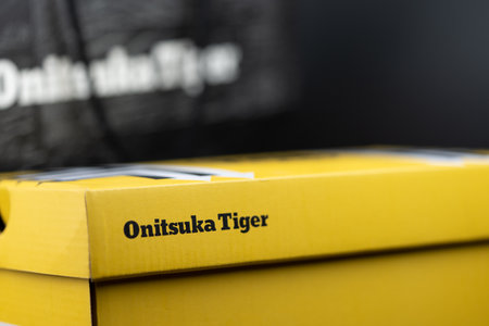 Bangkok, Thailand - February 25, 2023 : Close up of logo a Onitsuka Tiger on yellow shoe paper boxà¹のeditorial素材