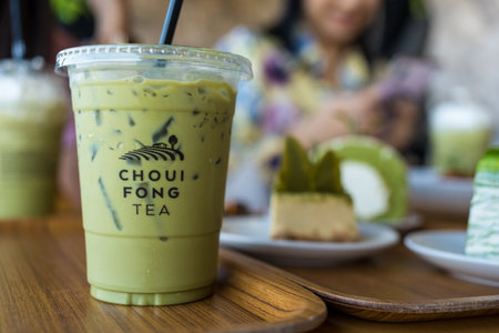 CHIANG RAI, THAILAND - March 7, 2023 : Iced green tea made from tea leaves of Choui Fong Tea Shop...