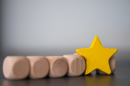 One standing wood yellow star. One star rating. Shallow depth of field.の写真素材