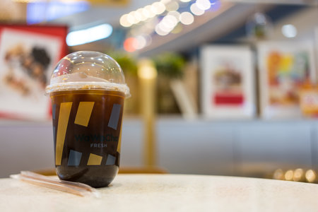 Samut Prakan, Thailand - April 1, 2023 : Glass of fresh Americano from Wawa Cha brand shop at Mega Bangna shopping mall. Close upのeditorial素材