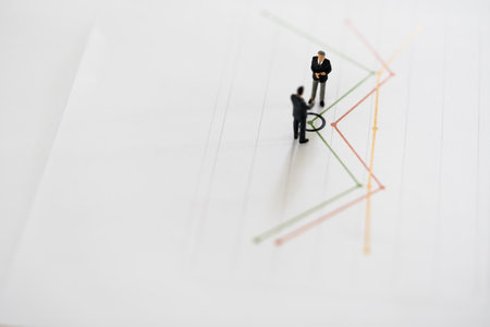 Miniature model of businessman thinking with point on graph project for presenting investment...