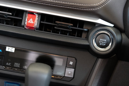 Bangkok, Thailand - April 15, 2023 : Car engine start stop button and car interior details of new...