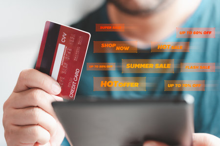 Man or shopper using a tablet with shopping credit cards and text of best promotion for online...