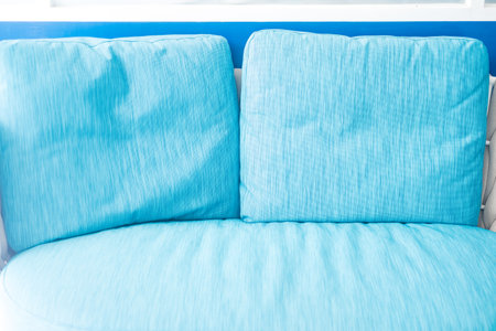 Close up of blue pillow on blue sofa for relax. Close upの写真素材