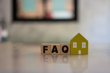 Wooden blocks with the word FAQ for home, frequently asked questions. Collection of frequently asked questions on any topic and answers to them about home. Instructions and rules on Internet sitesの写真素材